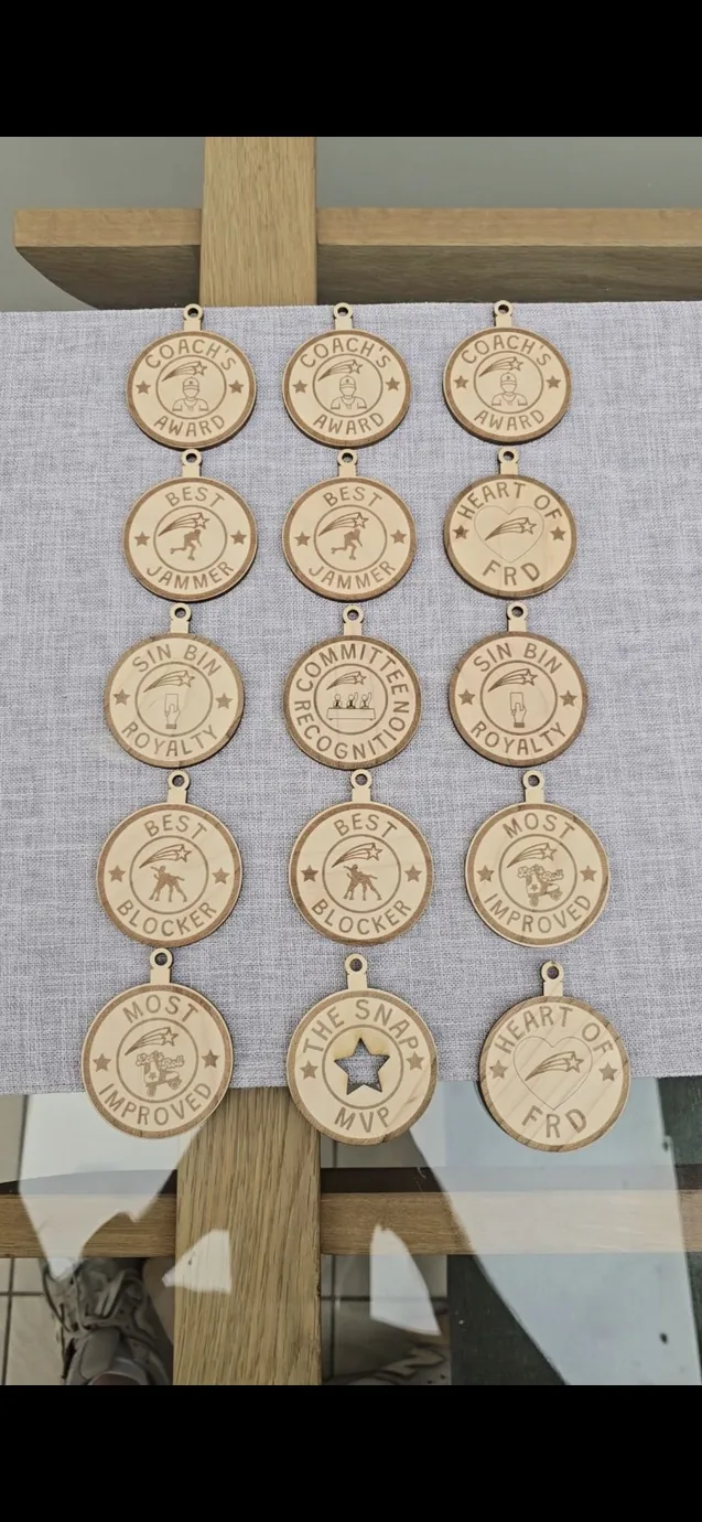 Real custom engraved wooden achievement medals made by Together We Etch