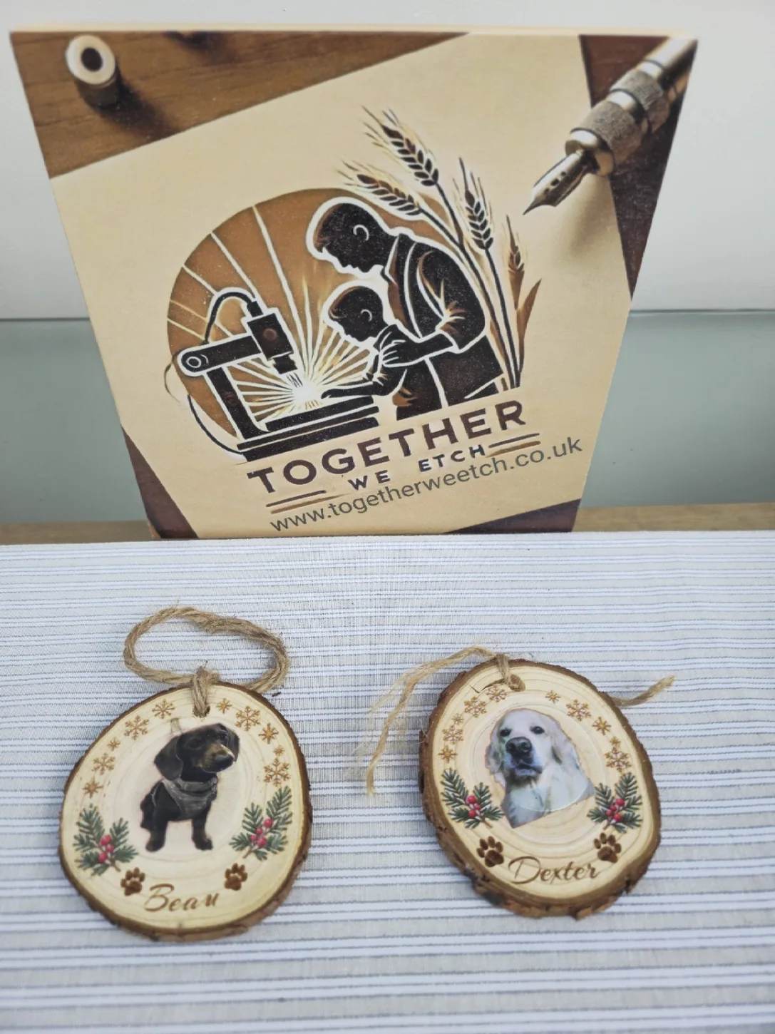 Two real personalised wooden Christmas pet decorations showing Bear and Dexter